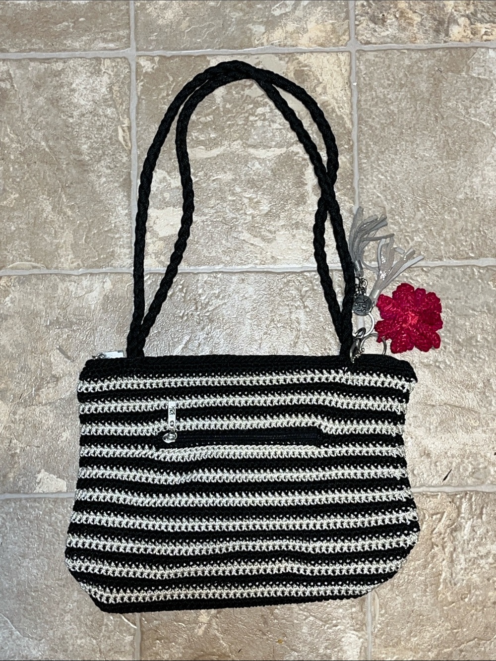 The Sak Black and White Striped Crochet Shoulder Bag with Pink Flower Charm